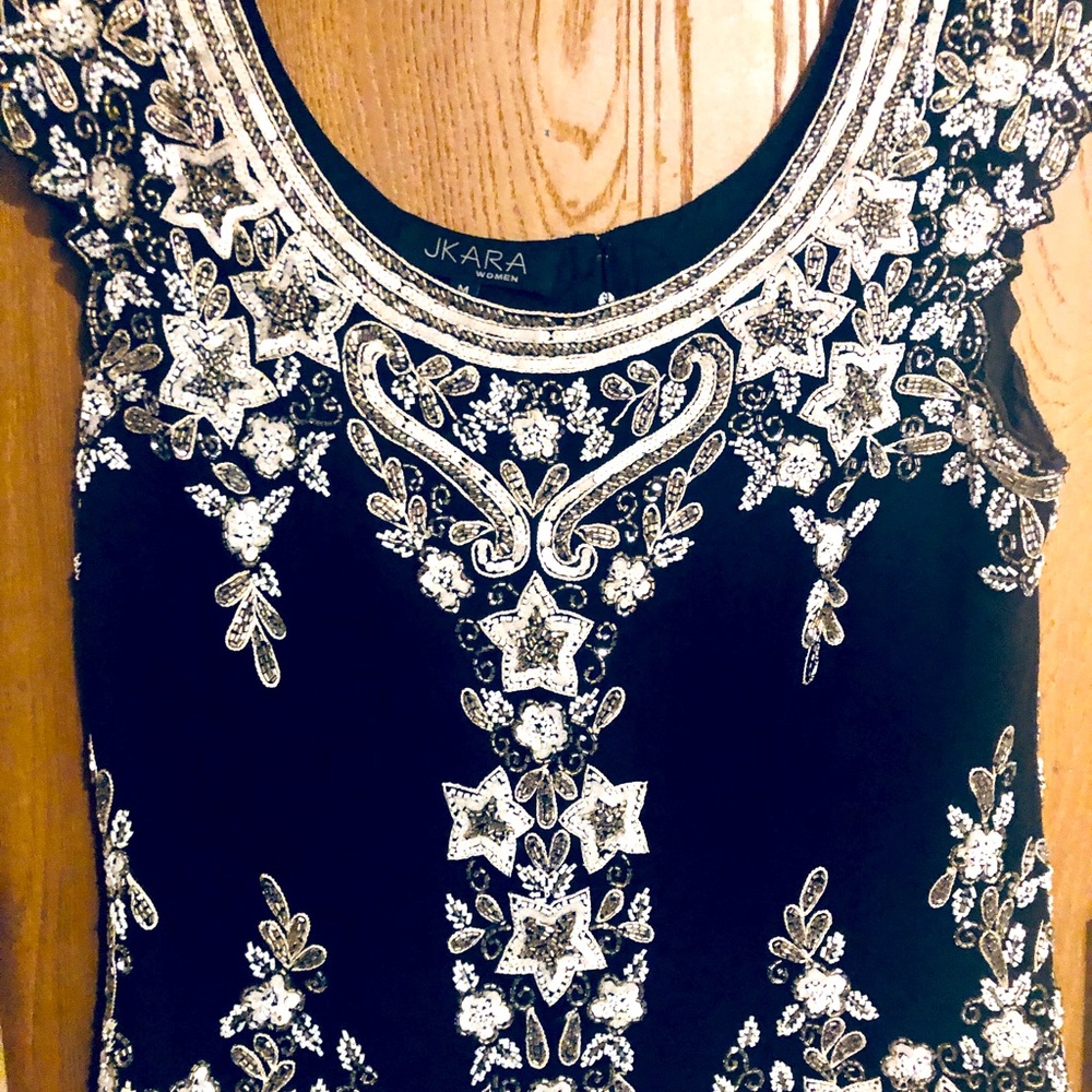 Women’s size medium sequenced Party Top.